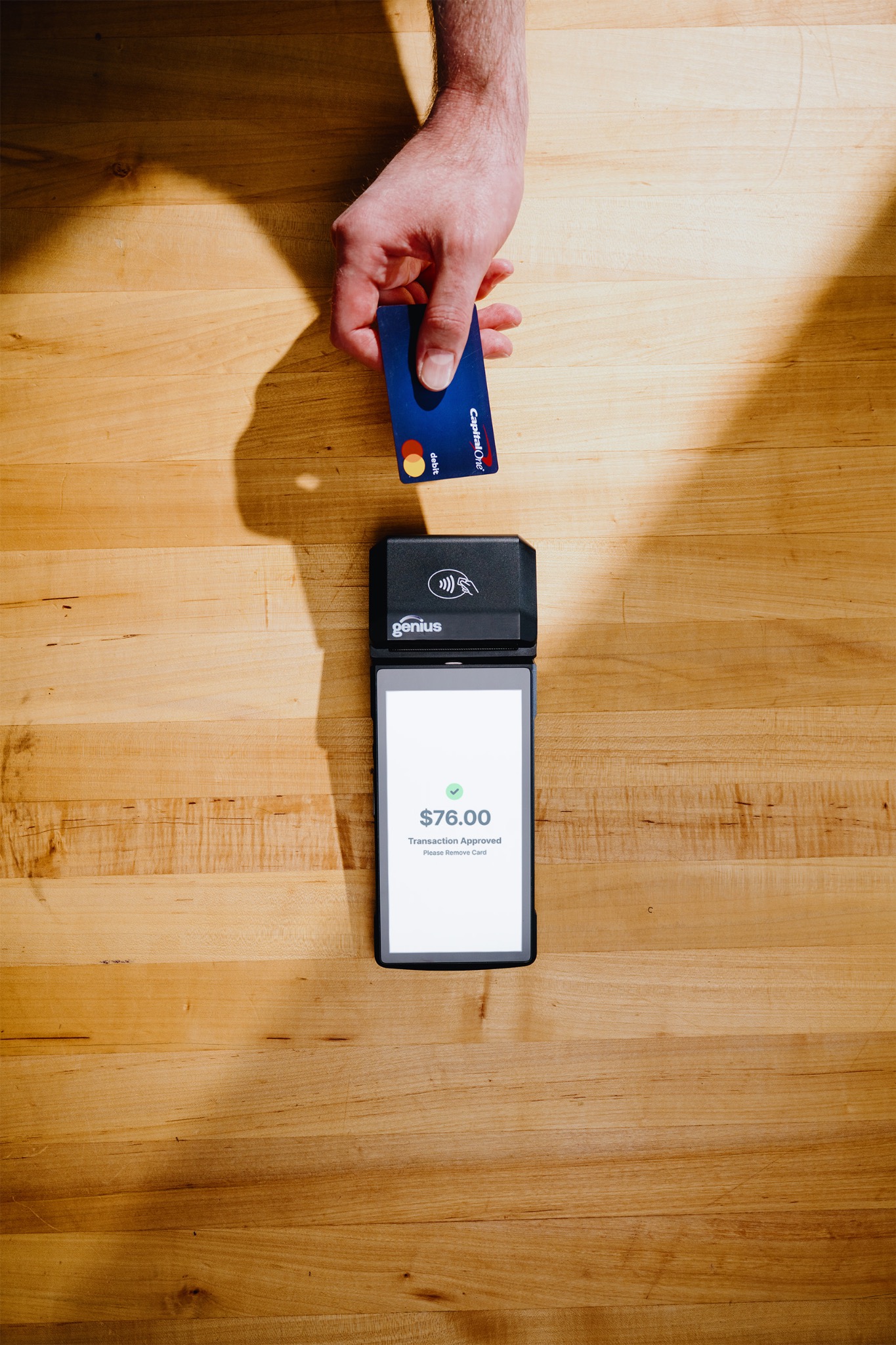 Genius handheld completing a restaurant payment